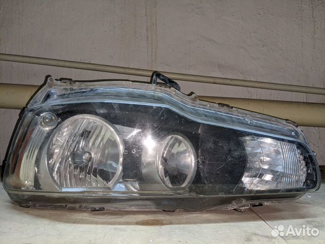 Фара левая 8301B075 для Mitsubishi Lancer